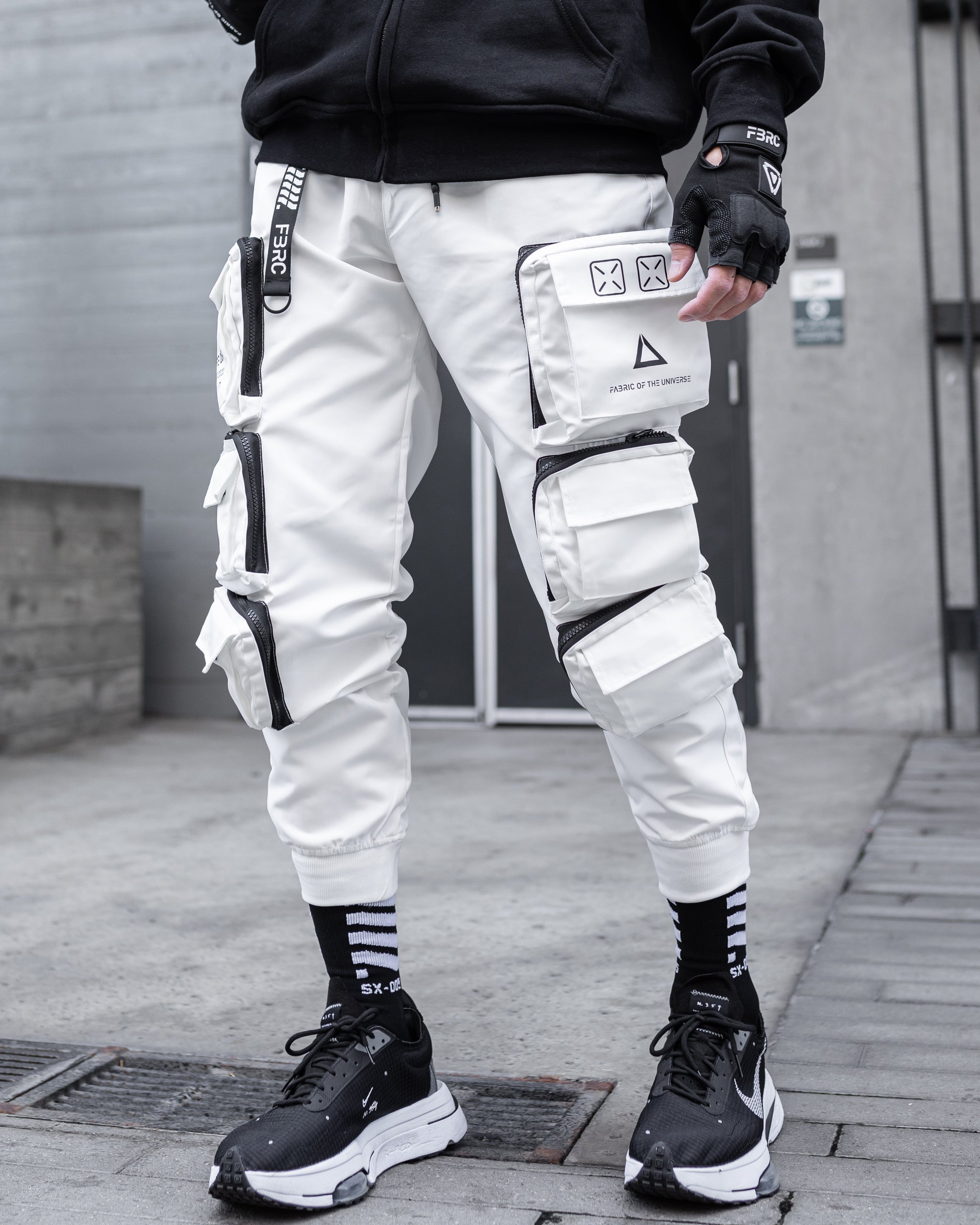 black baggy pants with white stitching